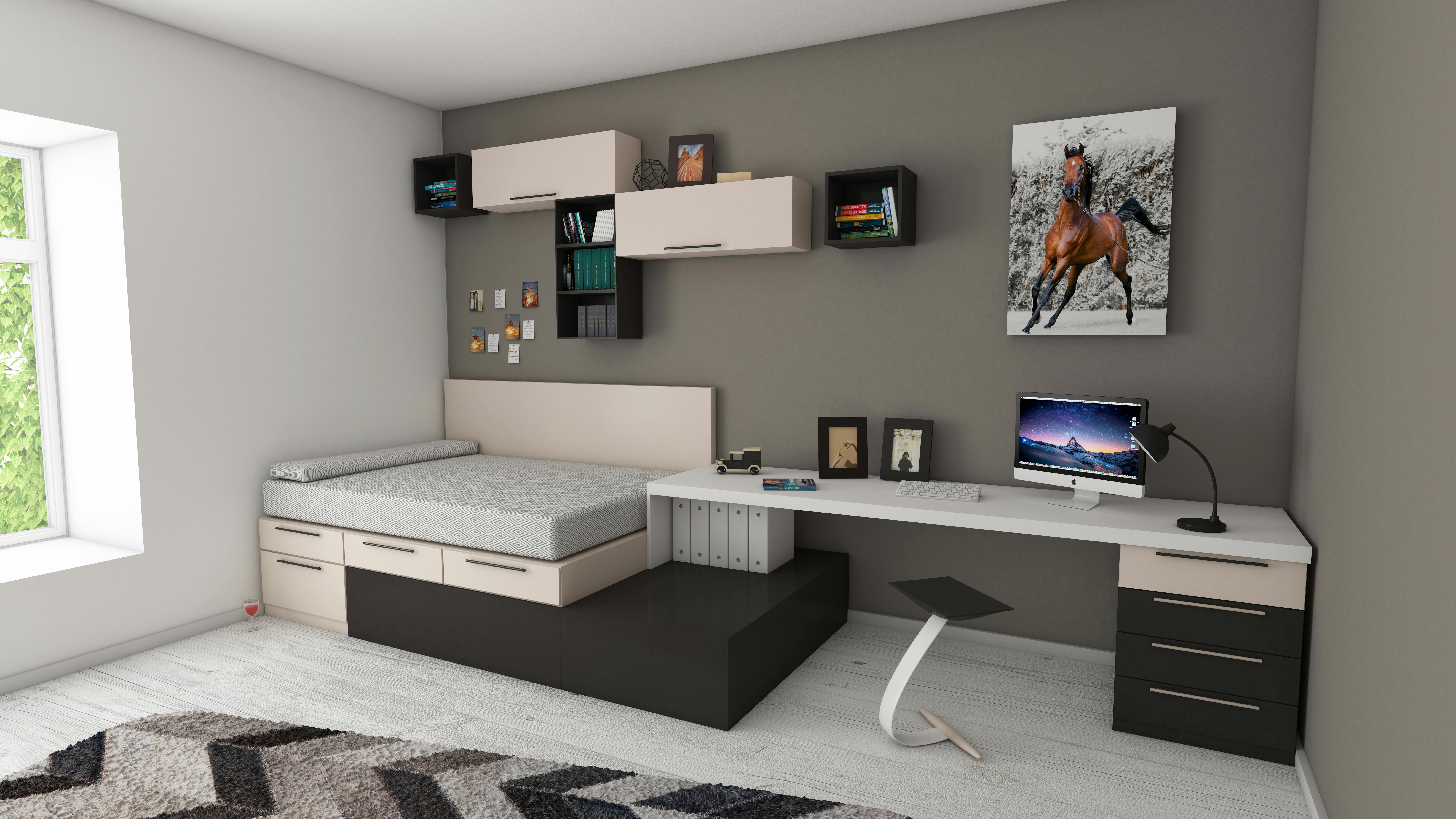 A bright living space with a sofa, artwork, and wide windows